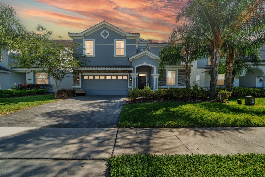 Sunny daytime view of Eliezer Staycation’s front exterior in ChampionsGate, showcasing modern architecture and welcoming entrance.