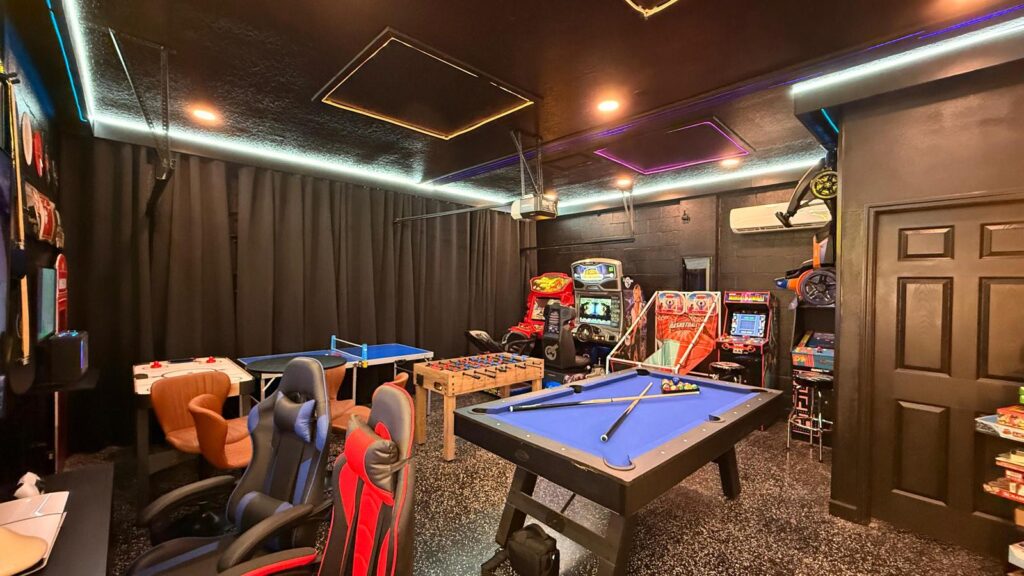 Spacious game room at Eliezer Staycation featuring billiards, PS5, and more