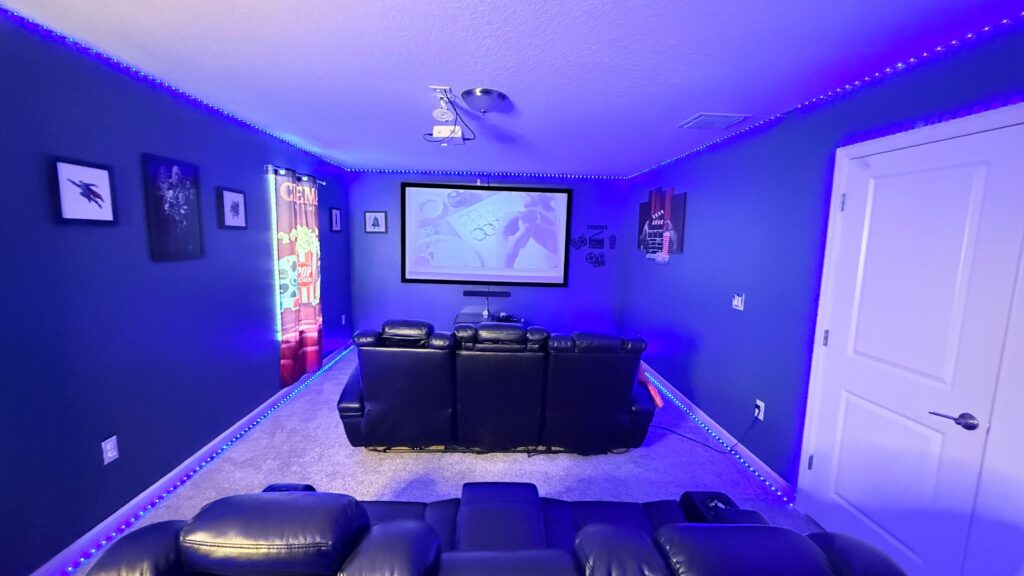 Spacious private cinema room with recliner seating and large screen at Eliezer Staycation, a luxury vacation rental near Disney